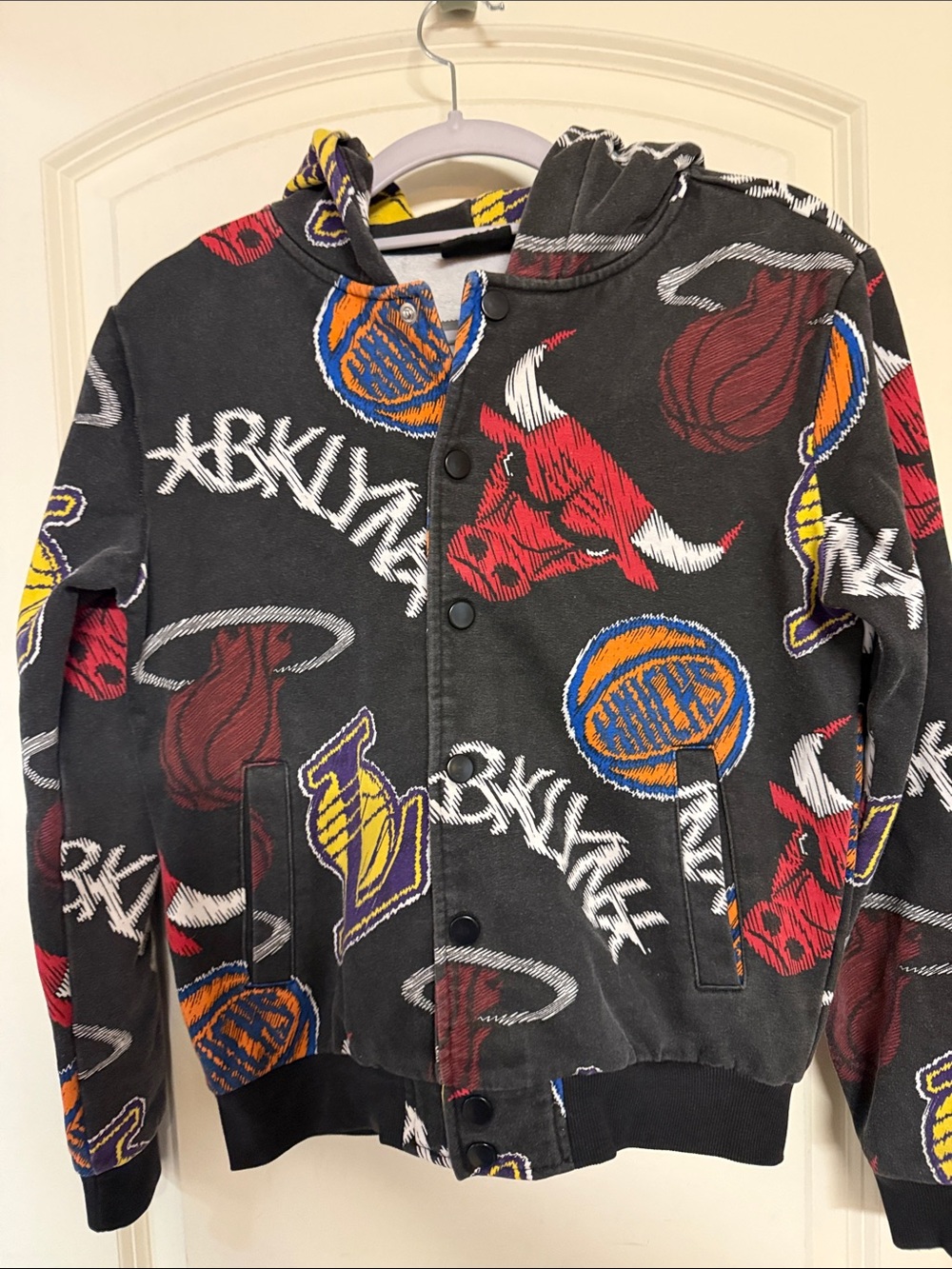 NBA Kids Black Jacket with Red, Yellow, Orange & Blue Team Logos